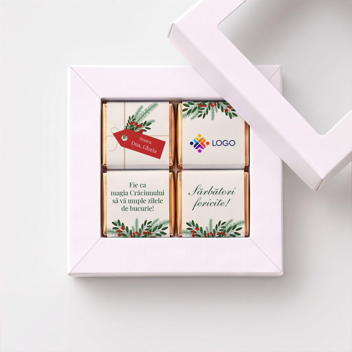 Caja de regalo con 4 minichocolates personalizados con logotipo y mensaje navideño