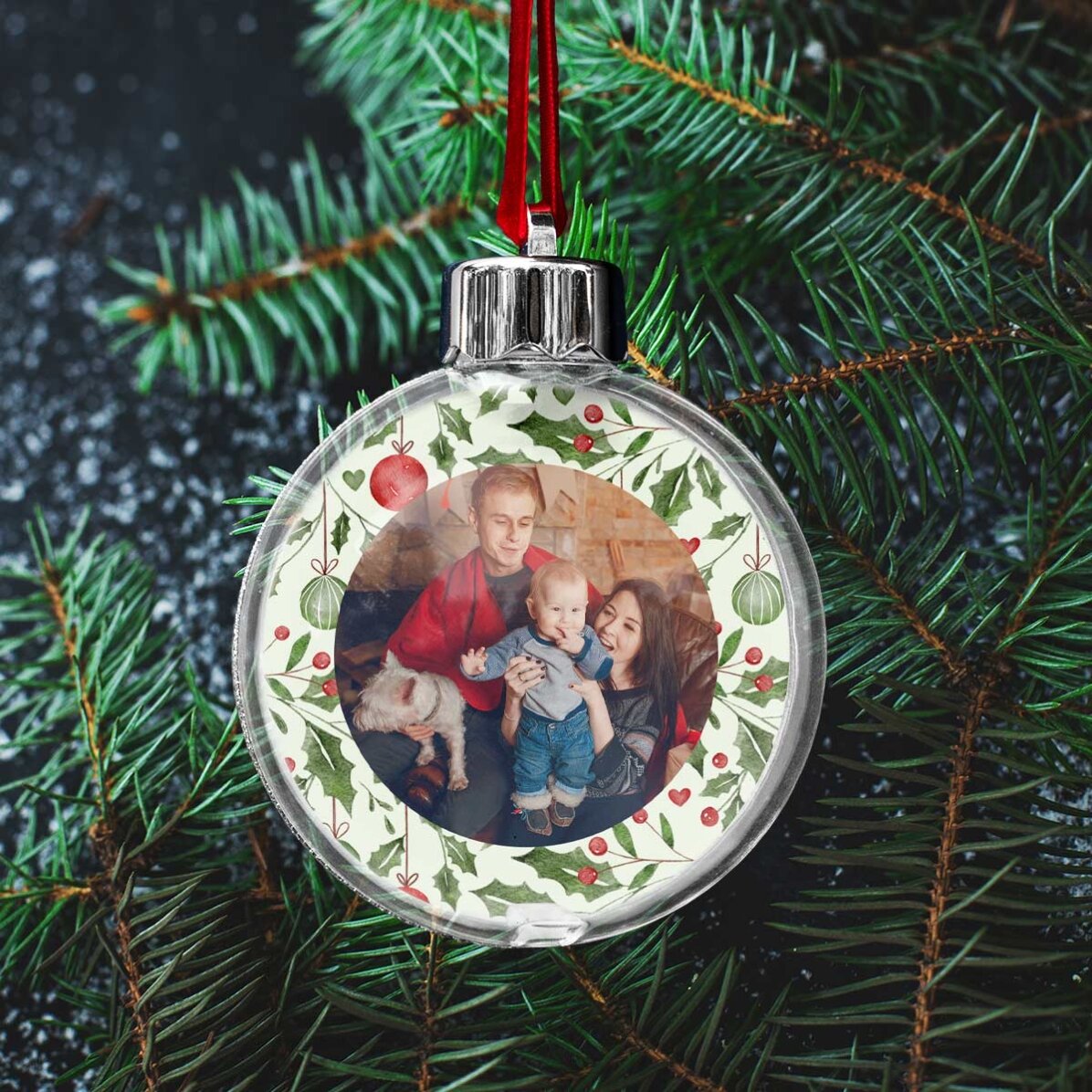 Bola de Navidad transparente personalizada por ambos lados con una foto y un mensaje: «Mi primera Na