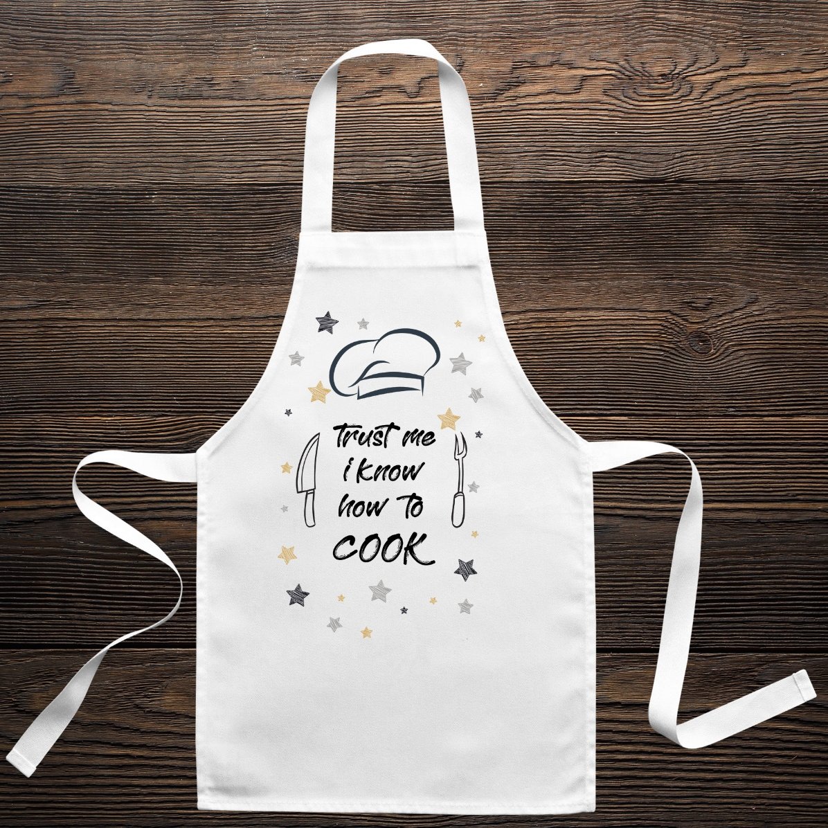 Polo personalizado para niños con el texto: «Trust me, I know how to cook»