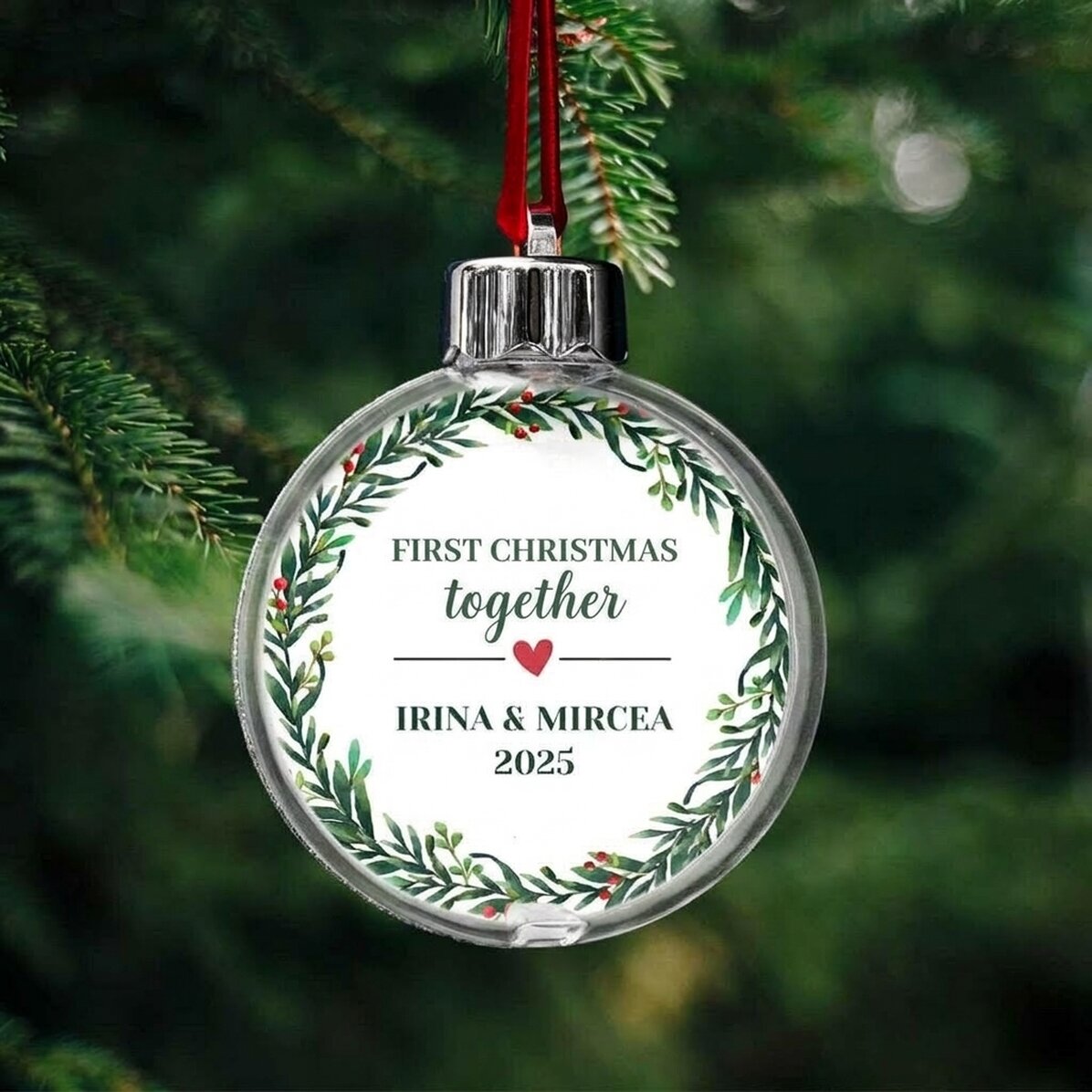 Bola de Navidad transparente personalizada por ambos lados con una foto y un mensaje: «Nuestra prime